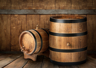 Barrels on wooden background, space for text