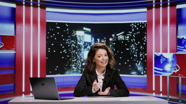 Woman night talk show host going live on tv program to present latest celebrity scandals for media and entertainment segment at midnight. Presenter journalist discusses about breaking news events.