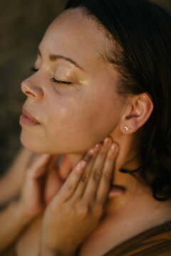 Young woman doing relaxing self care in nature