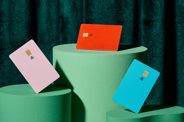 Template of bank cards on a pedestal over green curtain