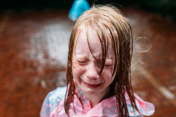 Little Girl crying in the rain