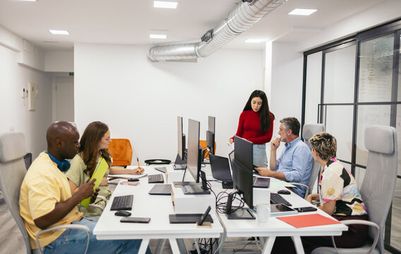 Group Of People Working with computers In A Office