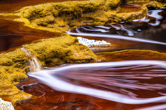 Abstract background of river with red and orange water
