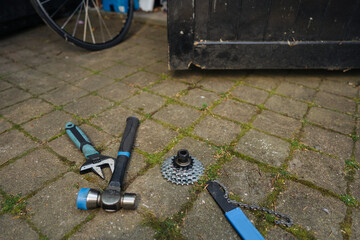 Set of different tools lies in the backyard