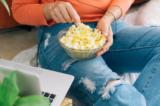 Home entertainment enjoying popcorn.