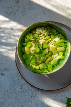 Spring vegetables and orzo in lemon vegetable broth.