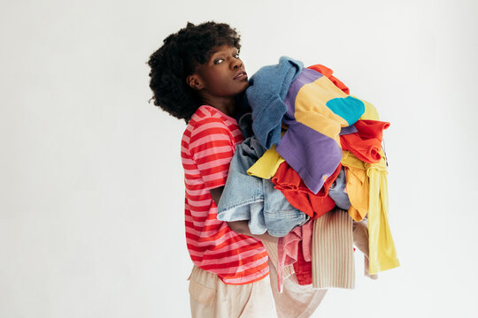 Woman with Bunch of Different Clothes