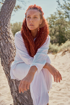 Senior beautiful woman relaxing on the beach.
