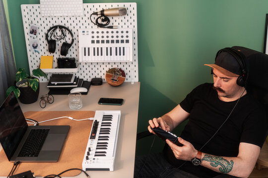Musician In His Home Studio Making Music