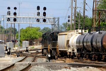 Fototapeta na wymiar Railroad locomotive pulling hazardous Chemical tank cars