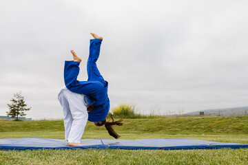 Teenagers training judo in park