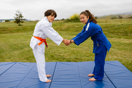 Formal greeting judoka couple outdoors
