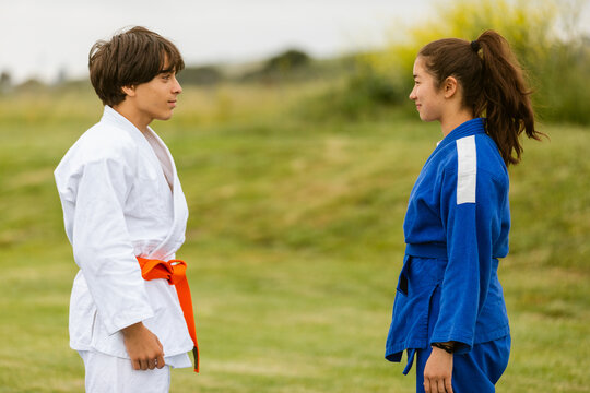 Diverse teenage judo couple in nature