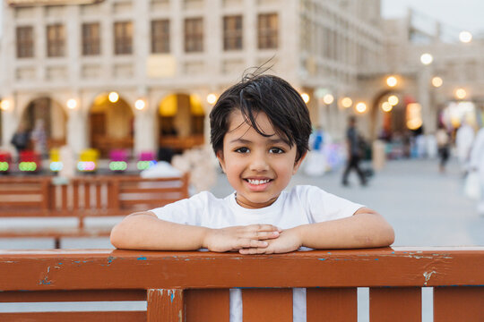 Happy little Indian boy in city