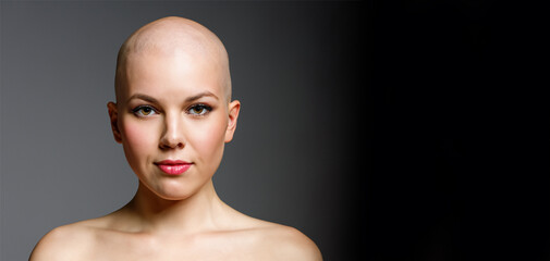 portrait of a young woman, bald head, studio background