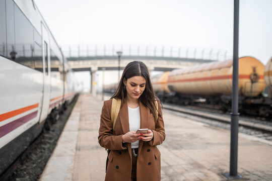 young woman in train station