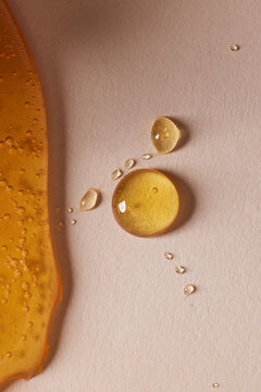 Honey Drizzle and Droplets in Soft Light with Shadow