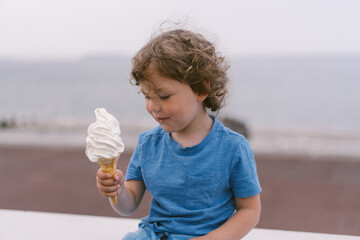 Boy holds an ice cream