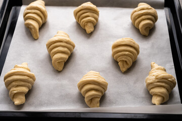 Before and after -homemade croissant baking at home. Side view