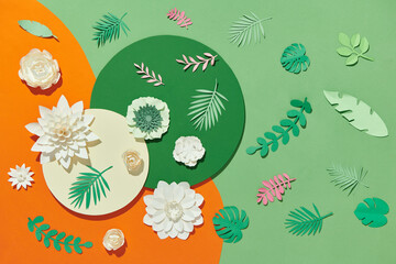 Flowers and green leaves arranged on paper frame