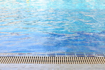 blue swimming pool texture background and surface of water