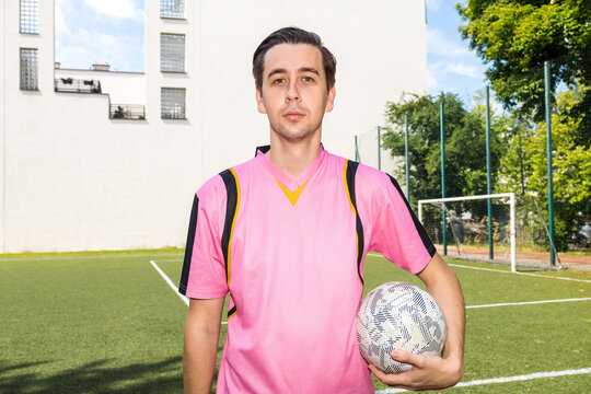 a football player holds the ball. Before/After