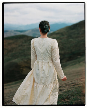 Film photo of gIrl looking at the mountains