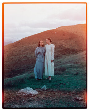 Analogue photo with leaks of gIrls posing in front of mountain hills