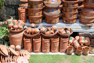 Different sizes and shapes pottery display on the shop counter