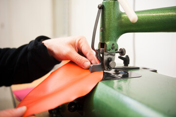 Craftsman working with colourful leather