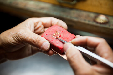 Artisan hands working with jewelry