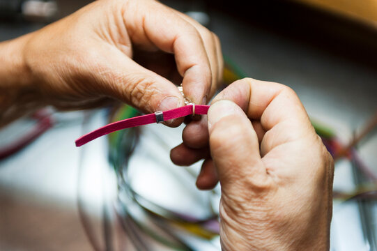 Artisan hands creating bracelet