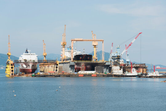 A dockyard in the ocean at the sunset