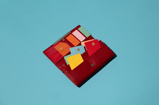 Colorful credit/debit cards in red purse. Money, cashless, payment
