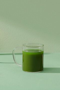 Glass cup of green matcha tea 