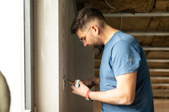 Electrician connects the switch wires