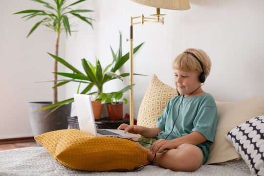 blonde boy with laptop