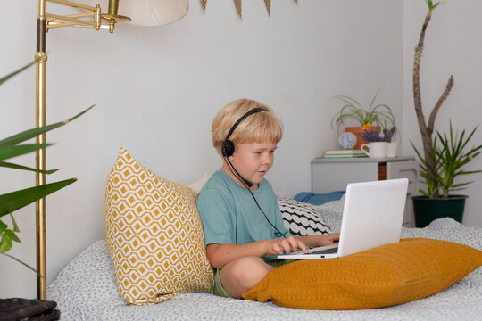 blonde boy with laptop