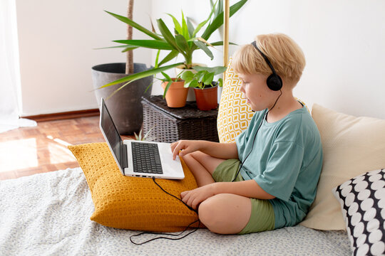 blonde boy with laptop