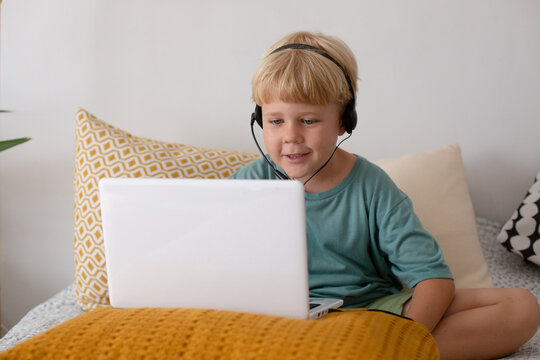 blonde boy with laptop