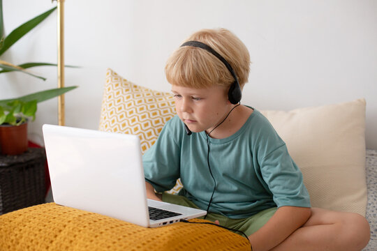 blonde boy with laptop