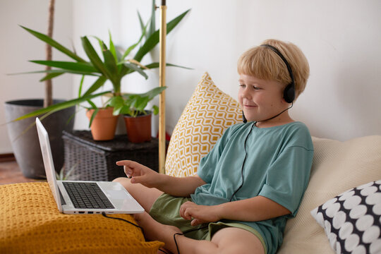 blonde boy with laptop