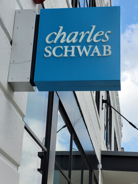 Millburn, New Jersey, USA - August 17, 2023: A sign outside the Charles Schwab office. No people.