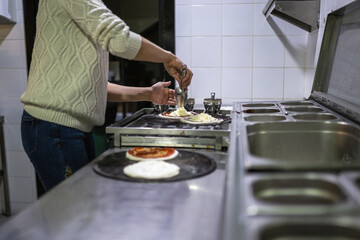 woman preparing pizza