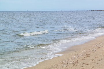 Wave of the sea on the sand beach