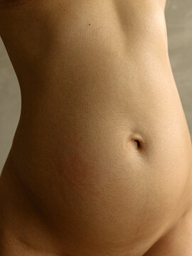 Close-up of a 4-month pregnant belly