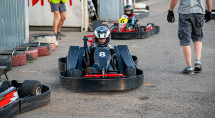 Boy in a go-cart race car ready to start