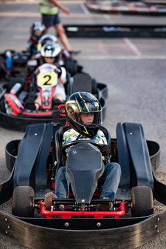 Boy in a go-cart race car ready to start