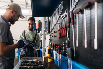 Two Men Working in Car Garage 