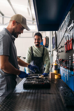Two Men Working in Car Garage 